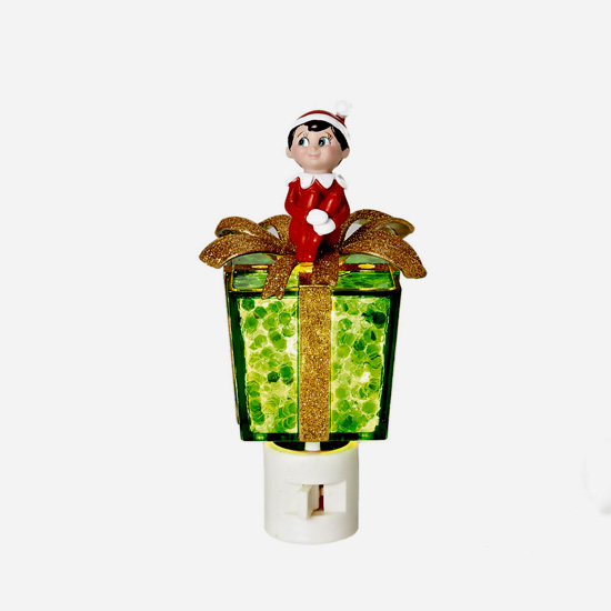 The Elf on the Shelf Night Light Scout Elf Sitting Atop a Green Present
